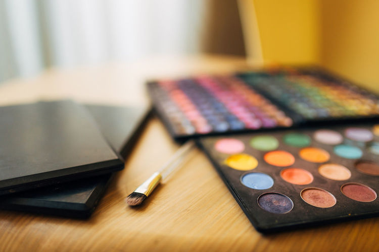 Close-up of make-up palette on table
