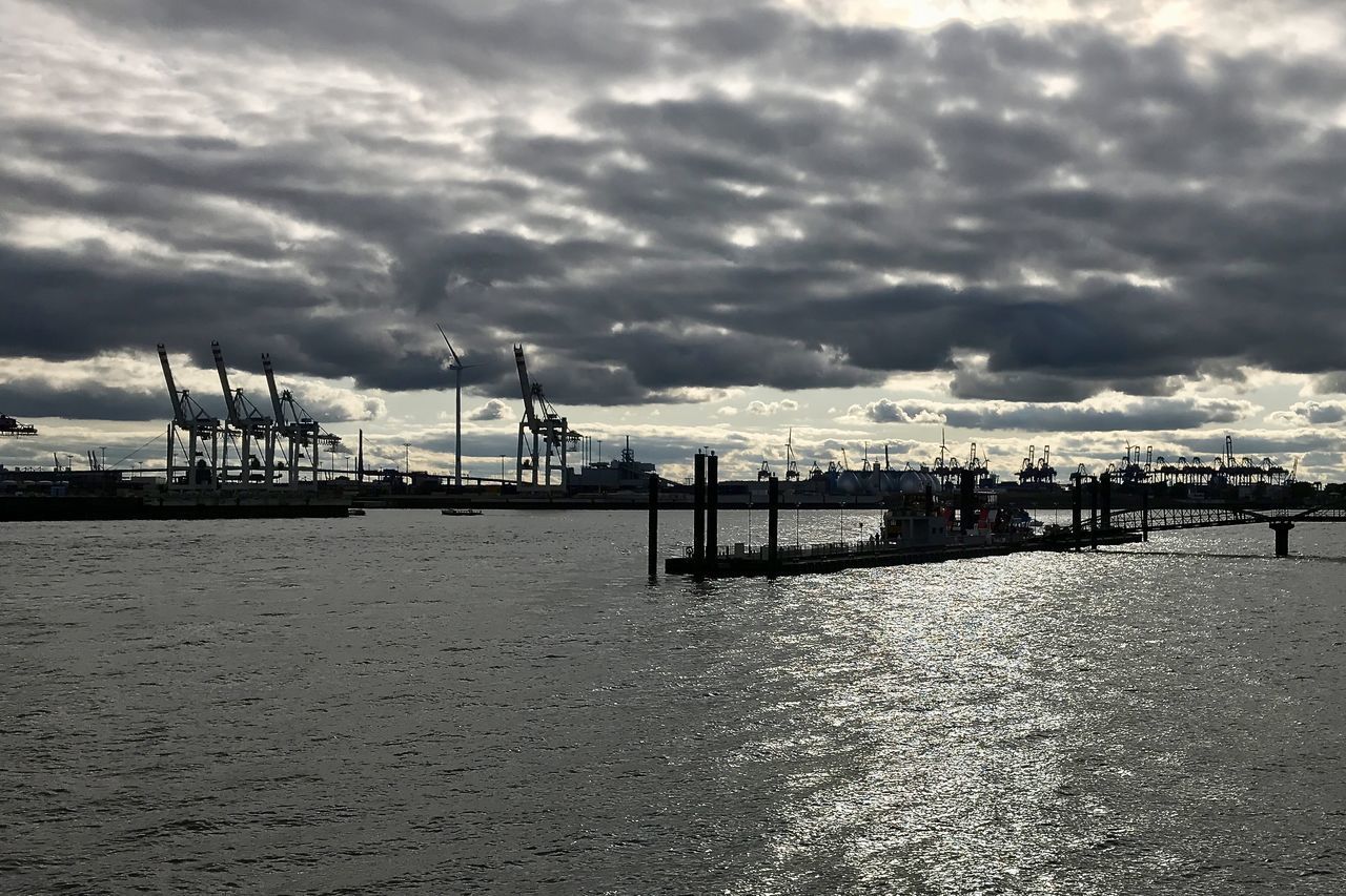 COMMERCIAL DOCK AGAINST CLOUDY SKY