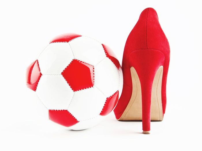 Close-up of red ball against white background