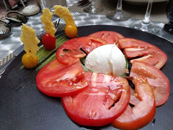 High angle view of fruits in plate on table