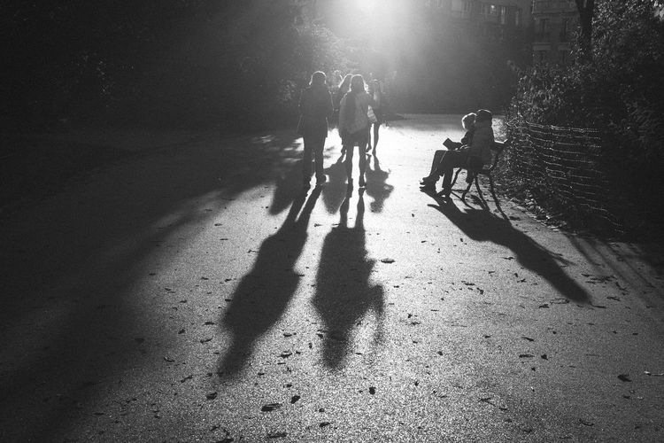 Shadow of people on road