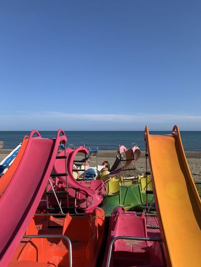 High angle view of slides at beach against sky