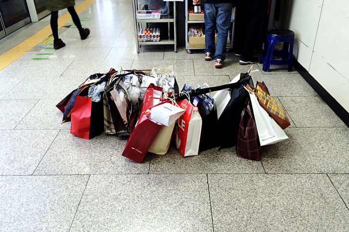 High angle view of shopping bags on floor