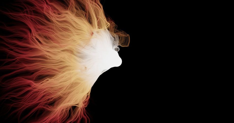 Close-up of woman against black background
