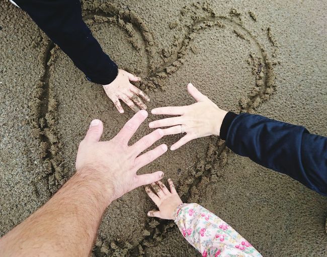 Hands on beach