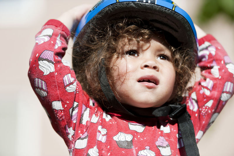 Small girl in bicycle helmet