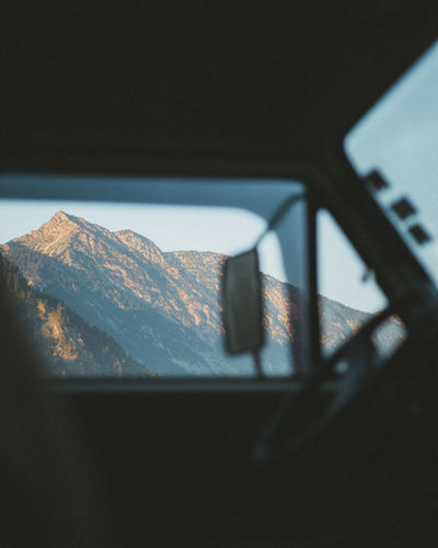 Mountain seen through car window