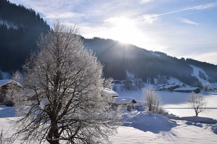 Scenic view of snow covered mountains against sky