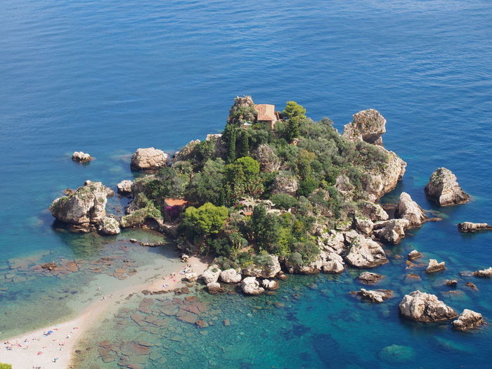 Scenic view of small island on the sea