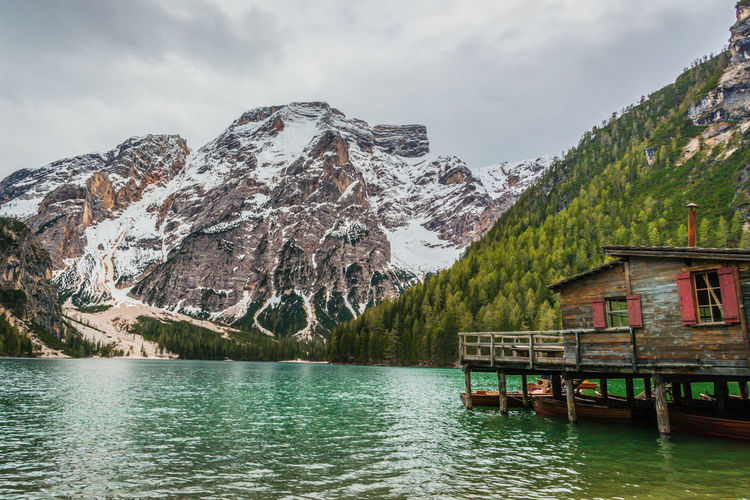 Scenic view of lake and snowcapped mountains against sky
