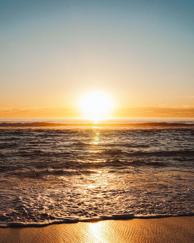 Scenic view of sea against sky during sunset