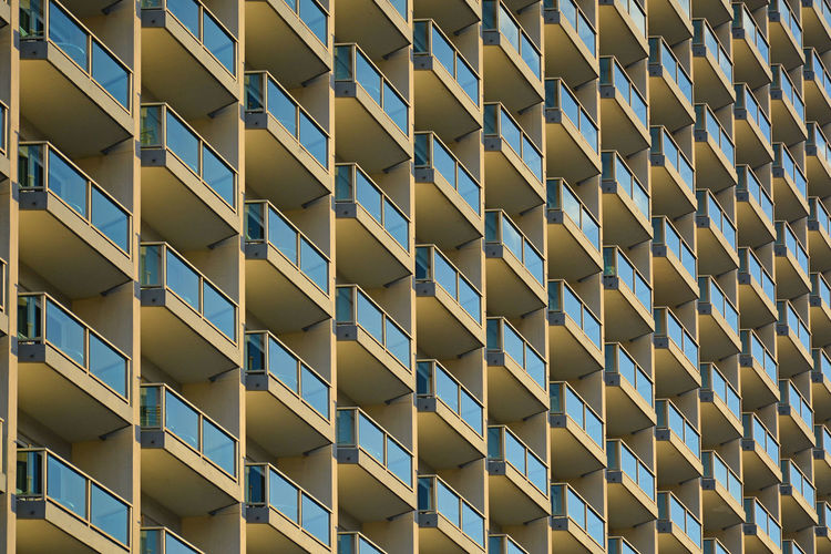 Full frame shot of apartment condo building  balconies pattern