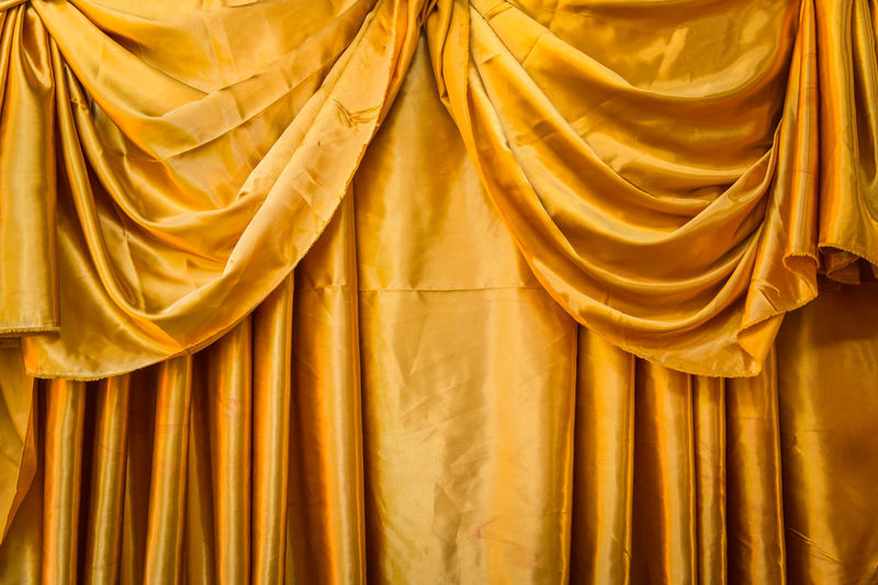 Full frame shot of yellow curtains