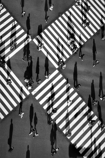 High angle view of people crossing street
