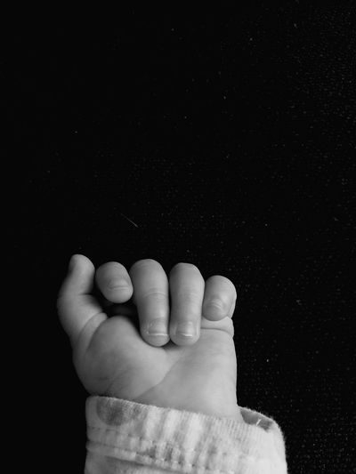High angle view of baby hand