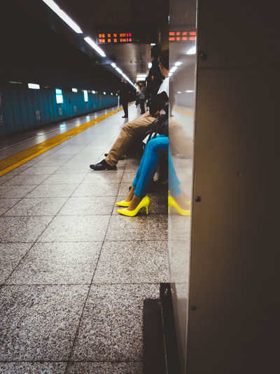 Blurred motion of man moving on illuminated subway station