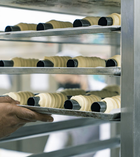 Dough for pastries. process of making pastries in the bakery. cropped hand of person preparing food