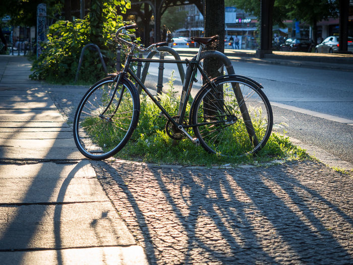 Bicycle parked on street in berlin kreuzberg