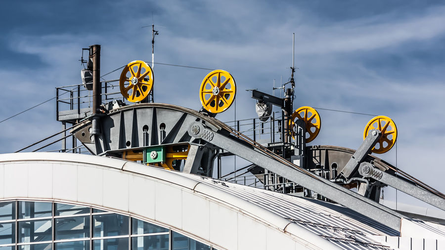 Low angle view of ferris wheel against sky