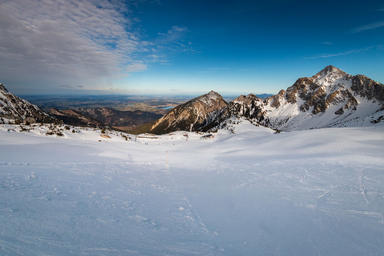 Scenic view of snowcapped mountains against sky