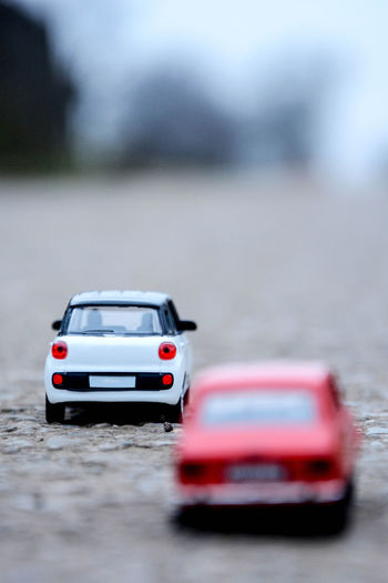 Red toy car on road