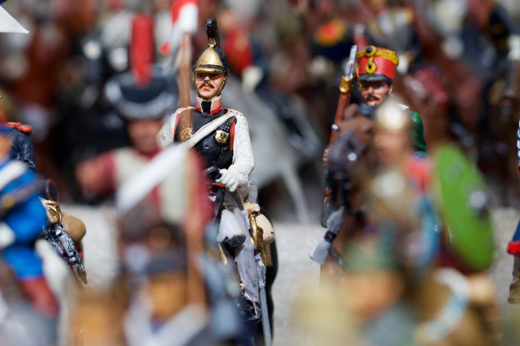 Close-up of figurines against blurred background