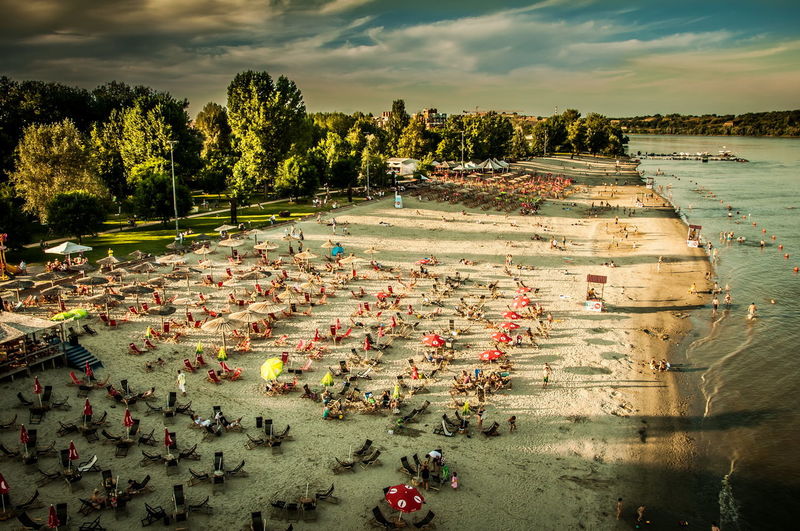 High angle view of people on shore against sky