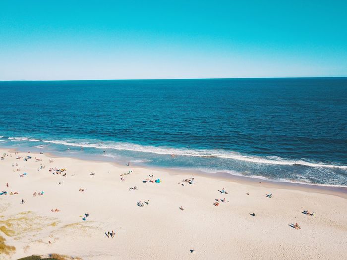 Scenic view of sea against clear blue sky