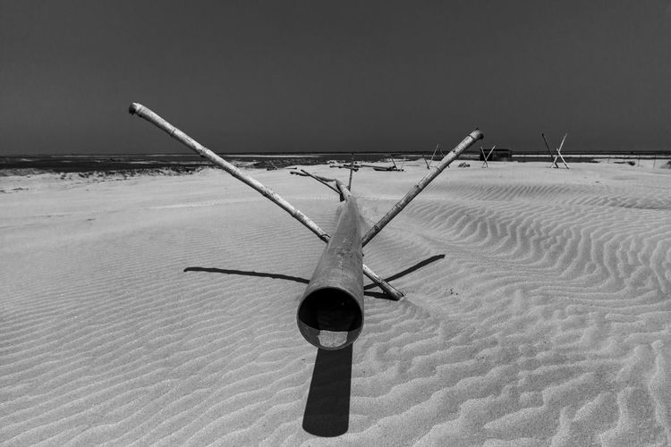 Airplane on snowy field against sky during winter
