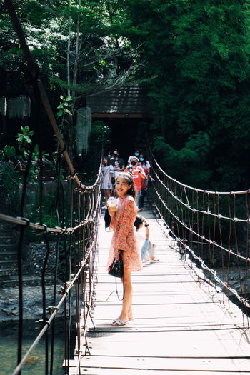 People walking on footbridge