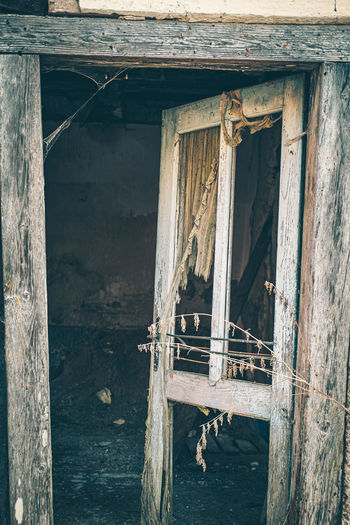 Abandoned house by window