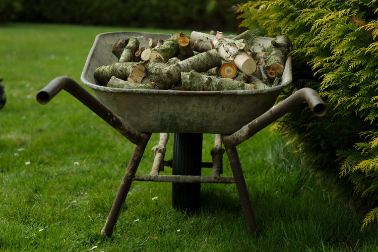Container on barbecue grill in yard