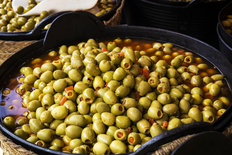 Baskets of olives stuffed with red pepper