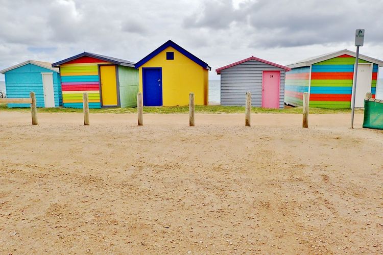 Colorful huts on sandy beach