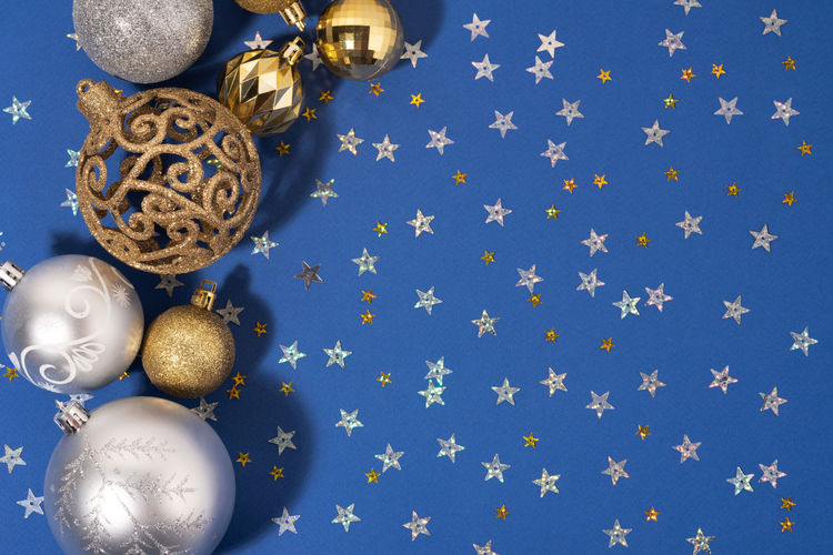 Directly above shot of christmas decorations against blue background