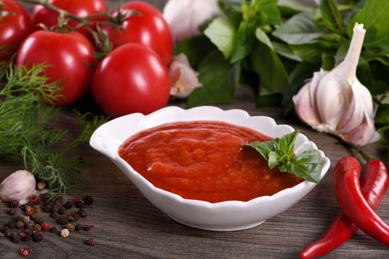 Traditional classic homemade tomato sauce  spices and herbs. fragrant dressing for various dishes