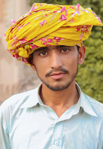 Close-up portrait of young man wearing turban