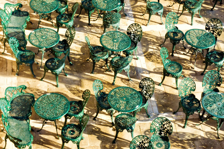 Full frame shot of tables and chairs during sunny day