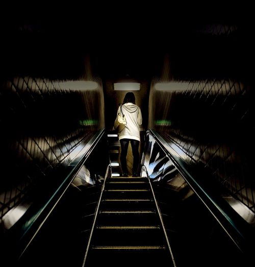 Woman standing in tunnel
