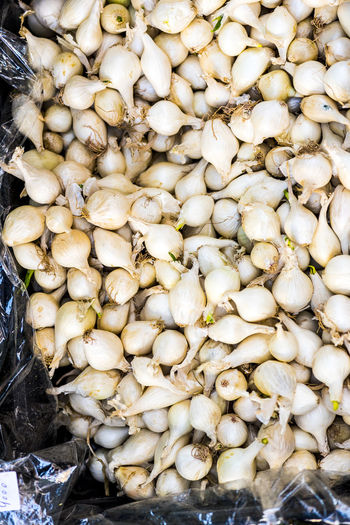 High angle view of garlic for sale at market stall