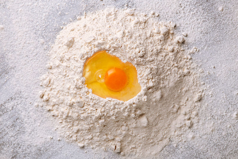Close-up of egg on flour
