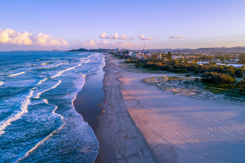 Scenic view of beach against sky during sunset