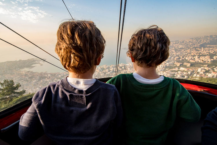 Rear view of boys in overhead cable car