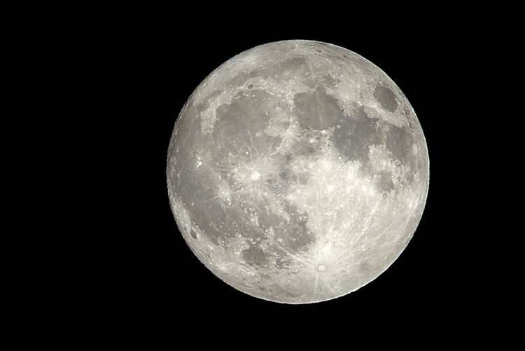 Low angle view of full moon at night