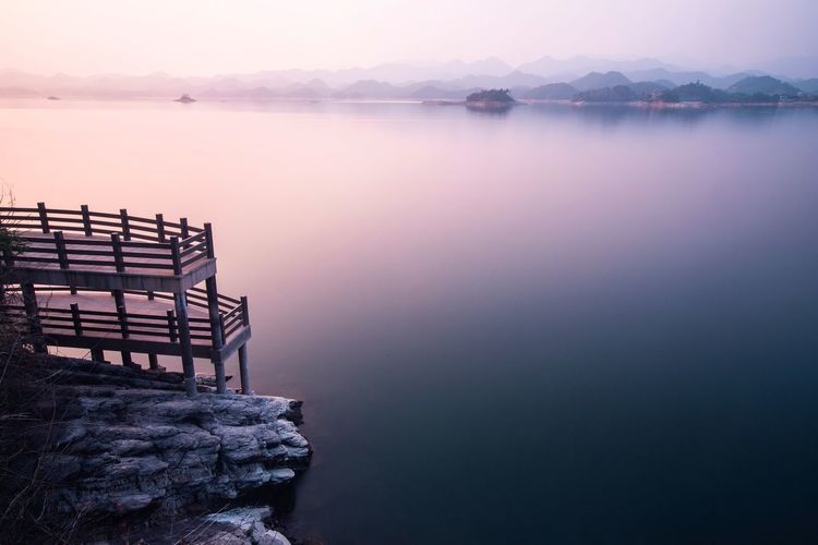 Scenic view of lake with mountains in background
