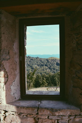 Scenic view of old building seen through window