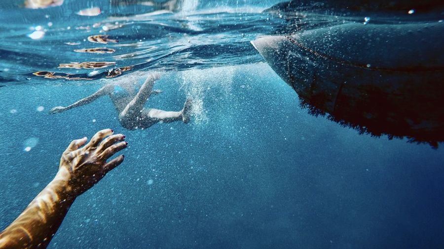 People swimming undersea