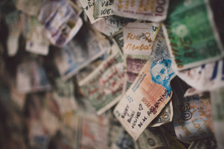 Full frame shot of paper currencies hanging on wall