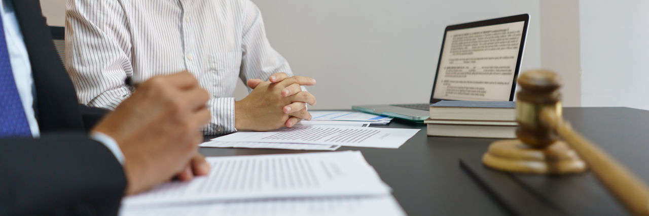 Midsection of business colleagues working at office