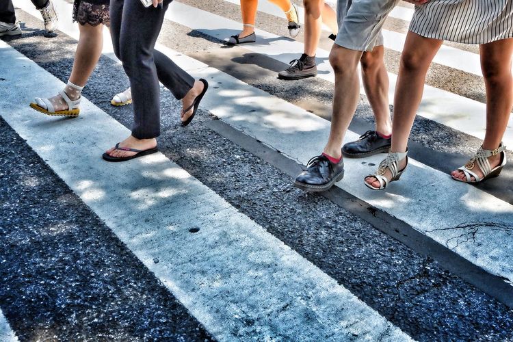 Low section of people crossing road